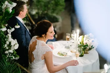 A bride and groom sitting at the table