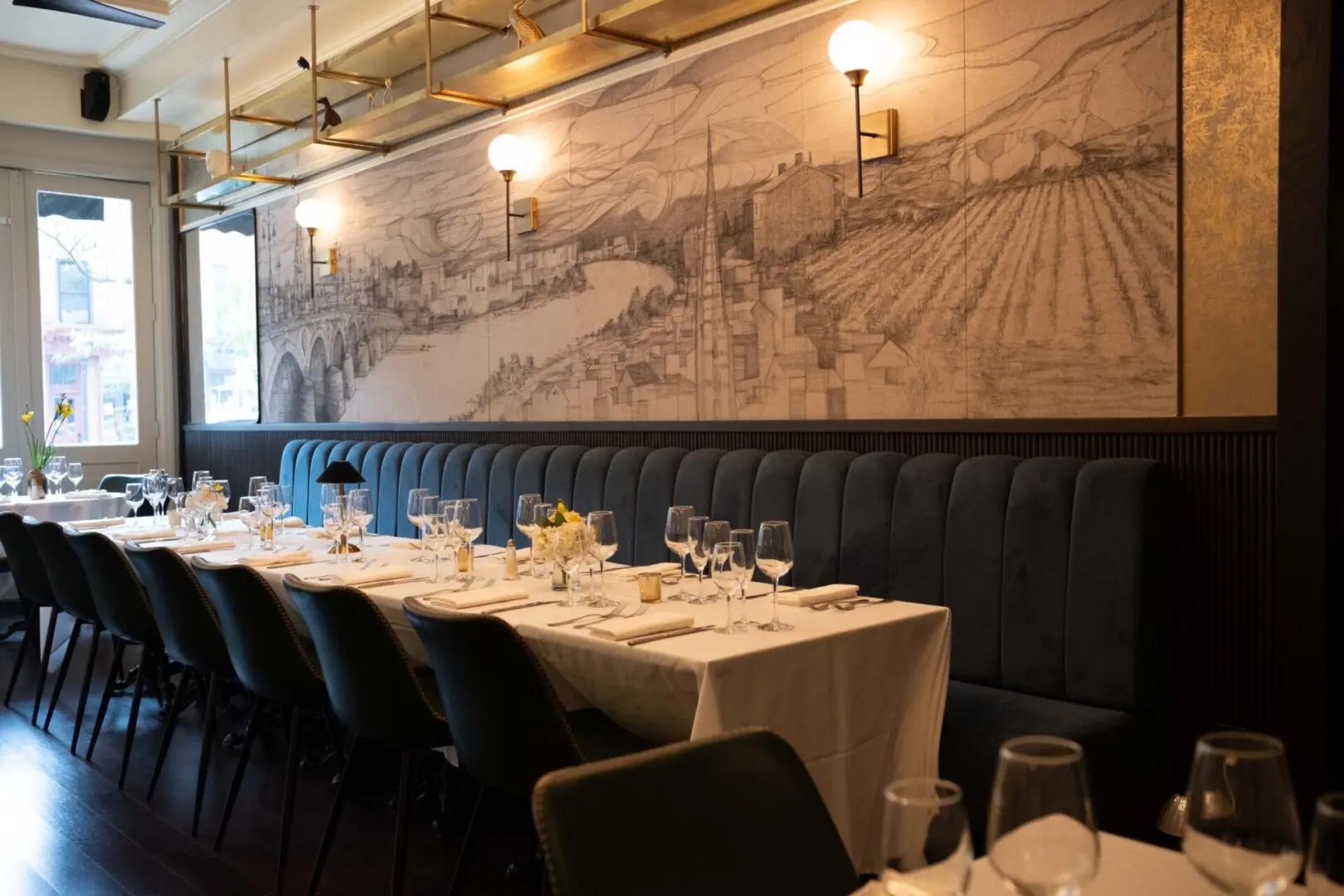 Restaurant table setting with a city drawing.