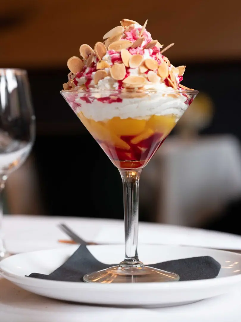 Dessert with almonds and fruit in a glass