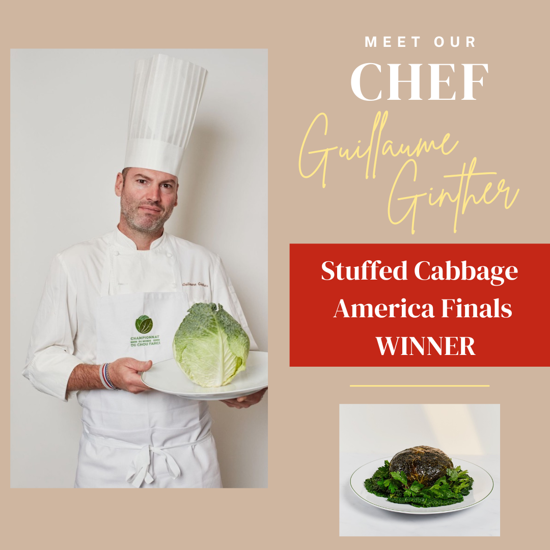 Chef Guillaume Ginther holding stuffed cabbage.